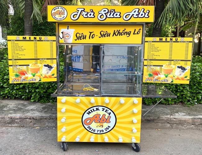 Xe bán trà sữa Abi bảng menu phụ màu vàng